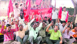 Power loom workers protest in Ludhiana on Monday.