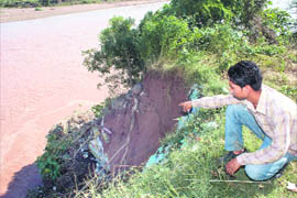 The swollen Ghaggar runs alongside the Chhatbir Zoo at Banur.