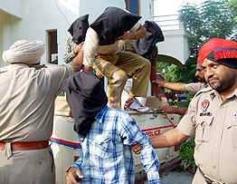 The accused in police custody. 
