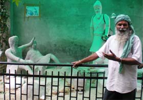 Gurcharan Singh Mann, owner of a farmhouse at village Tungwali (Bathinda) shows the statues installed at the entrance of his house