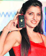 A model poses with Acer Ferrari mobile phone at its launch in New Delhi