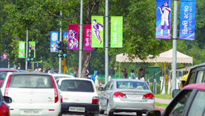 Commonwealth Games posters on lamp-posts at the India Gate in New Delhi on Tuesday.