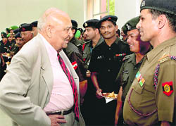 Former Governor of Jammu and Kashmir and ex-GOC-in-C, Western Command, Lt Gen SK Sinha (centre) interacts with troops on the eve of the 63rd Raising Day of the Western Command, at Chandimandir on Tuesday