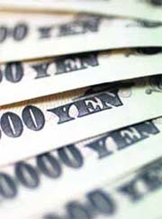 In this photo, Japanese 10,000 yen notes are spread out at an Interbank Inc. money exchange office in Tokyo