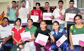 Winners of the weightlifting championship with their certificates in Sector 42, Chandigarh