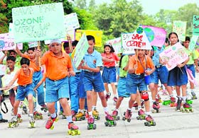 Students of Dikshant International School take part in a save environment rally on the eve of World Ozone Day at Sukhna Lake in Chandigarh