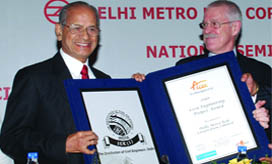 Delhi Metro managing director E. Sreedharan receives the Asian Civil Engineering Coordinating Councils Outstanding Civil Engineering Project Award for 2010 from the councils chairman Paul L. Mitchell on National Engineers Day in New Delhi 