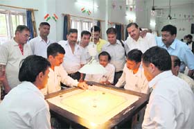 A match being played at the Bar Association Carrom Tournament in Dehradun