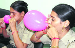 Women cops inflate balloons during a training session in Gurgaon