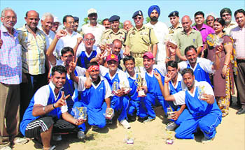 Jammu Dare Devils, which won the J&K Police Cricket Cup 2010 tournament for physically challenged, in a jubilant mood at AM Stadium in Jammu on Wednesday.