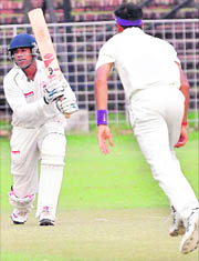 Rajesh Tabiyar of I-T Team plays a shot  against All-India Electricity Team during All-India JP Atray Memorial Cricket Tournament in Chandigarh on Wednesday.