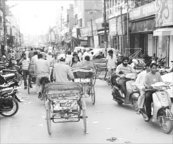 Commuters make their way through a narrow road at Sadar Bazaar in Ambala Cantonment.