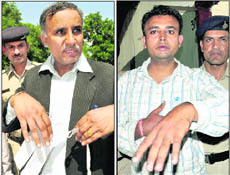 Advocate Ramesh Kumar and litigant Ravinder Kumar at the Sector 17 police station on Thursday.