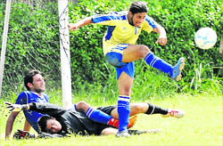 Players in action during a football match at Panjab University on Thursday.