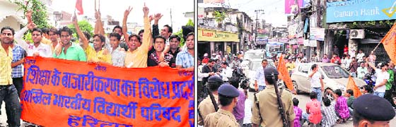 ABVP members hold a protest against commercialisation of education in Haridwar on Thursday and (right) a similar protest at the Clock Tower in Dehradun