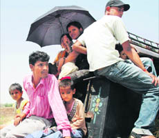 An overloaded auto-rickshaw in Faridabad.