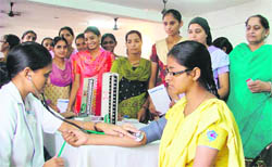 Students of the Master Tara Singh Memorial College for Women being examined by a team of medicos during a camp in Ludhiana on Thursday.