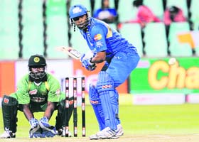 Mumbai Indians Kieron Pollard (R) plays a stroke against Guyana in Durban