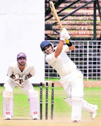 BS Tommar of BSNL team plays a shot against Punjab Cricket Colts in Chandigarh