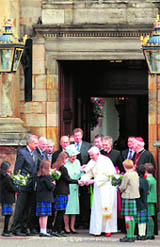 Queen Elizabeth and Pope Benedict XVI meet schoolchildren outside the Palace of Holyroodhouse in Edinburgh on Thursday.  AFP