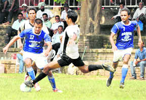 Players of SGGS Khalsa College, Mahilpur, and Gursar Sudhar College during a football match at Panjab University, Chandigarh, on Friday.