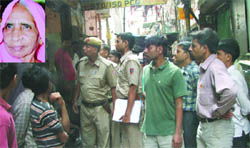 Cops outside the victims (inset) house.