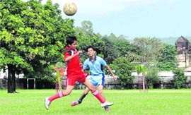 A match in progress at the Council School Football Tournament in Dehradun on Friday.