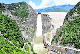 Excess water flows out of the Tehri Dam on Friday.