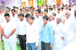 Activists of the Jat Arakshan Sangharsh Samiti observe silence in memory of Sunil Kumar, who died in police firing, at Nathusari Chopta in Sirsa 
