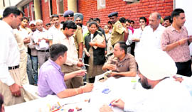 Judges dispose of cases during a lok adalat at the district courts, Sector 17,