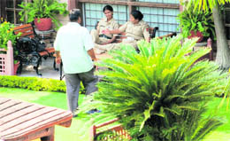 An IT sleuth and cops outside the residence of one of the directors of a pharmaceutical company during a search operation at Sector 6, Panchkula