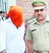 Dr Sofat being produced before a Panchkula court