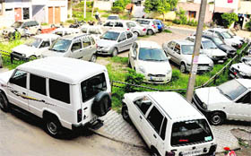 Cars parked in a park in a residential area in Sector 45-C, Chandigarh
