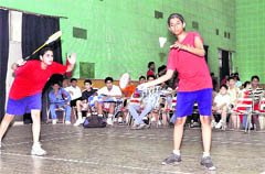 A doubles match in the District Badminton Championship under way in Dehradun