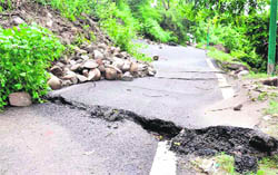 A road that was damaged due to a landslide near Mata Mansa Devi Temple in Haridwar.