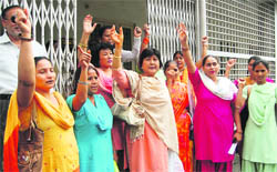 Members of the Mahila Congress hold a protest in Dehradun on Friday