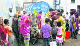 Residents fill water from a tanker in Sirsa on Saturday.