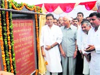 Public Health Minister Randeep Singh Surjewala inaugurates a water scheme at Ujhana village in Kaithal district on Saturday.