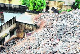 A house damaged in a landslide on the Neshville Road in Dehradun