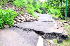 A road that was damaged due to a landslide near Mata Mansa Devi Temple in Haridwar