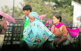 Woollens are out as temperatures dropped across the North following snow in high reaches of Himachal Pradesh. The Meteorological office recorded 13.6C in Shimla on Sunday.