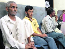 Cancer patient Balak Ram (left) at the Regional Cancer Centre, GMCH Hospital, Jammu.