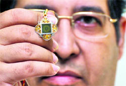 Rajiv Arora, projects director of Prakash Childrens Foundation, shows a locket carrying a miniature Bhagwad Gita in Ludhiana