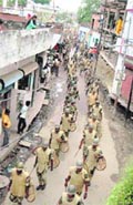 Security forces patrol a locality ahead of the verdict on Ayodhya title suits by the Allahabad High Court, in Lucknow on Sunday.