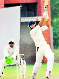 Bharat Lumba of PCC team plays a shot against Reliance CC during the JP Atray Cricket Tournament in Chandigarh on Sunday