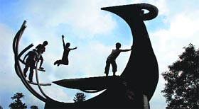 Children try out some stunts on one of the scuptures at Leisure Valley-10 Lifestyle.