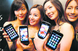 Models pose with the new Samsung Galaxy S Android smartphone at its launch at the Samsung Electronics headquarters in Seoul. Nokia is still easily the biggest cellphone maker in the world, with incredible market share in fast-growing markets such as India. But as its margins shrink and its Symbian operating system loses ground to upstarts like Google's Android, the company risks losing even that title.