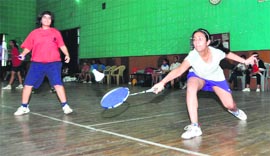 A match in the District Badminton Tournament under way at Parade Ground, Dehradun, on Monday.