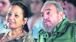 Cuban President Fidel Castro and Industry Minister Yadira Garcia in this October 20, 2004 file photo.