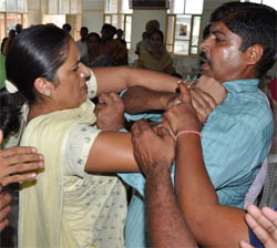 President of the AIE Teachers Union Swarna Devi and a member of the AIE Teachers Front slug it out at the Teachers Home in Bathinda on Tuesday